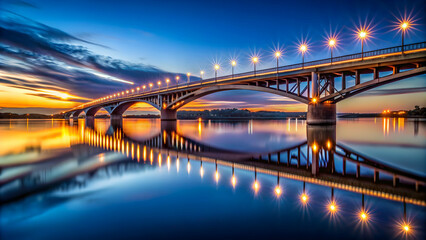 Fototapeta premium Conic bridge at dusk reflecting in water, bridge, architecture, dusk, evening, reflection, water, transportation, urban