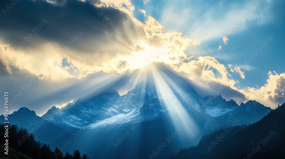 Wall mural Sun Rays Illuminating Mountain Peak