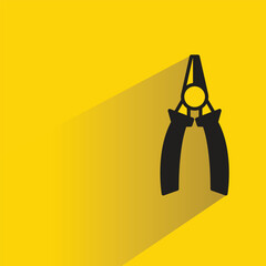 pliers tool icon with shadow on yellow background