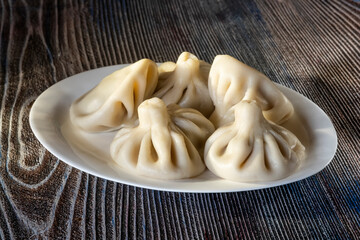 A plate of khinkali, the traditional dumplings of the Caucasus, showcasing the region’s rich culinary heritage
