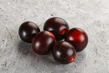 Raw ripe black kumato tomato