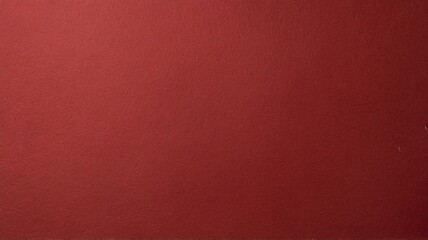 A solid red paper texture useful for various background designs and creative projects. The color is bold and rich.