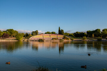 Fototapeta premium Pond and stands of the Las Cruces park in the city of Madrid in the Carabanchel neighborhood