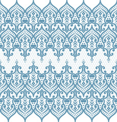 A decorative pattern featuring intricate floral and geometric designs in blue tones, suitable for textiles or wallpapers.