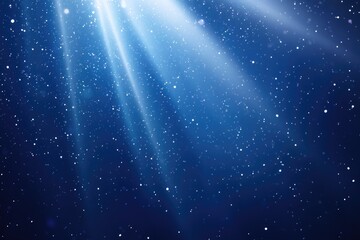 Fototapeta premium Abstract sparkling light rays and light beam sparkle against on dark blue sky background
