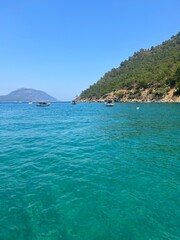 Fototapeta premium holiday summer turkey antalya turk beach ocean sand mountain boats sea trees nature sun hot weather swiming lake view 