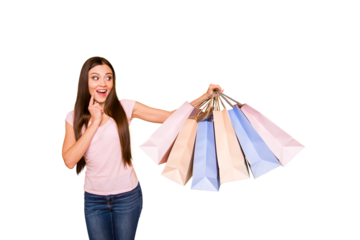 Portrait of her she nice cute charming lovely attractive cheerful cheery feminine straight-haired girl holding in hands new cool bags purchase isolated on bright vivid shine yellow background