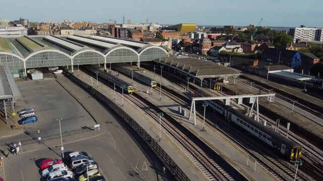 Drone. UK northern train service. Train on tracks.