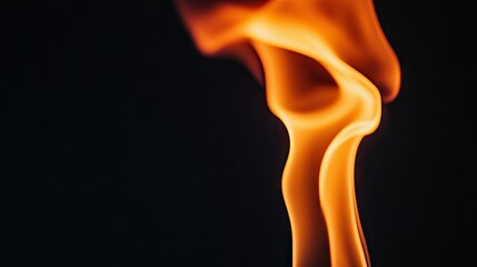A dramatic close-up of a single flame flickering in the wind, casting a warm glow against a black background.