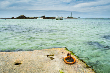 A view of the sea, Lighthouse and boats on the coast of Brittany (France) in summer,Plouguerneau, with Phare de la Vierge
