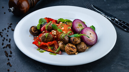 Garnish grilled zucchini, tomatoes, champignon mushrooms and sweet peppers, red onion, pesto sauce, basil and pine nuts.
