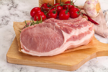Raw potk loin steak with bone