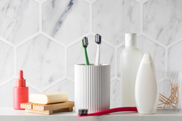 Personal hygienic toiletries collection on bathroom shelf