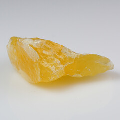 Exquisite Yellow Calcite Mineral Specimen with Textured Surface on Neutral Background for Geological Study