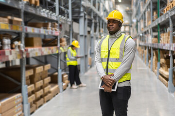 Portrait of smiling african american engineer man order details on tablet checking goods and supplies on shelves with goods background in warehouse.logistic and business export