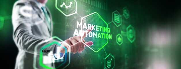 Marketing automation on the virtual screen. Man clicks on the inscription Marketing