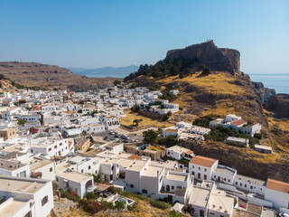 Aerial view of Lindos, Rhodes - a little old white Greek town on the Mediterranean coast to the foothills of the Acropolis if Lindos