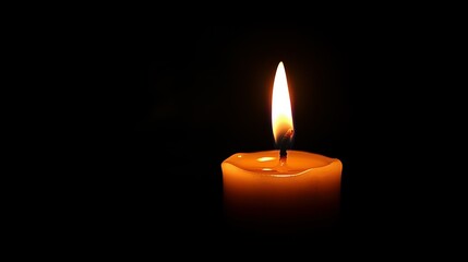 A solitary candle burns brightly against a dark background, casting a warm glow and creating an atmosphere of tranquility and contemplation