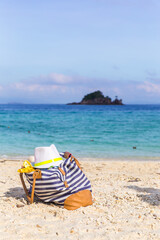 Beach bag on sand