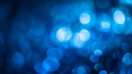 Obraz premium An abstract representation of blue bokeh lights creating a captivating atmosphere during the night