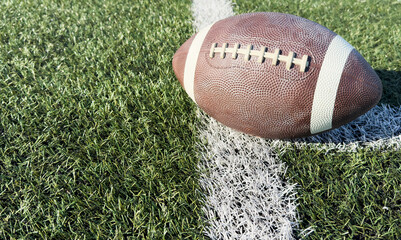 Pro American Football on the Field Close Up with Yard Lines Beyond