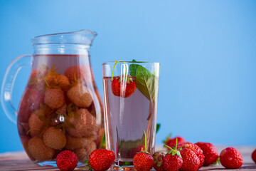 Sweet refreshing berry compote of ripe strawberries in a decanter