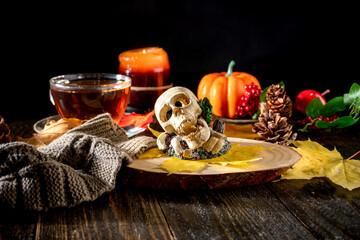 Autumn Decor with Scarves, Pumpkins, Candles, and Yellow Leaves