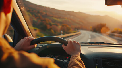 A person driving a car along a scenic road during a vibrant sunset, capturing a moment of adventure and freedom.