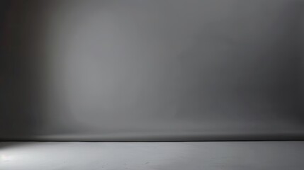 A gray background with a slight gradient and a visible crease at the bottom