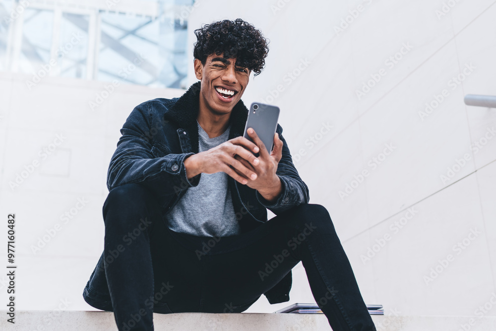 Poster latino hipster guy rejoicing at urban setting happy from received good comments and reviews for own 