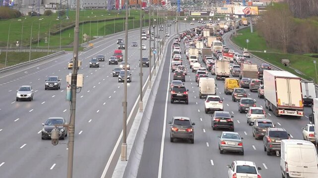 Moscow May 19 2024, Traffic jam on one side of the motorway. Moscow MKAD evening in summer. heavy traffic on a busy highway. heavy traffic on a busy highway.