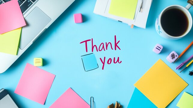 Handwritten  Thank You  Note on Office Desk with Workspace Supplies
