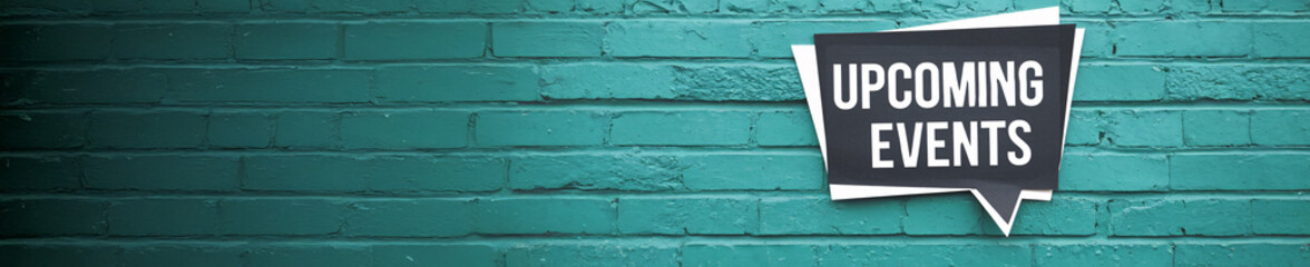Fototapeta premium Bold 'Upcoming Events' Message on a Textured Turquoise Brick Wall in a Minimalist Style