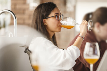 Woman Sommelier Tasting Beer During Training Beer School. Alcoholic Beverages Degustation Courses. 