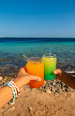 Two cocktails by the sea. Selective focus.