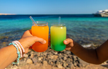Two cocktails by the sea. Selective focus.