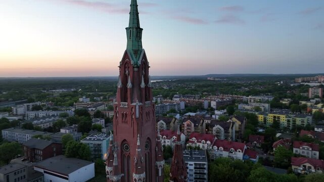Large colorful Ferris wheel in city center. Aerial drone view on Colorful Ferris wheel spinning in the city center Dabrowa Gornicza Poland. Colorful Ferris wheel From a bird's eye view drone at night.