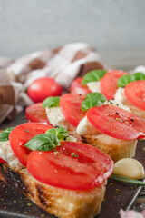 Italian Bruschetta on Ciabatta: Fresh Tomatoes, Garlic, and Olive Oil on a Wooden Table, Rustic
