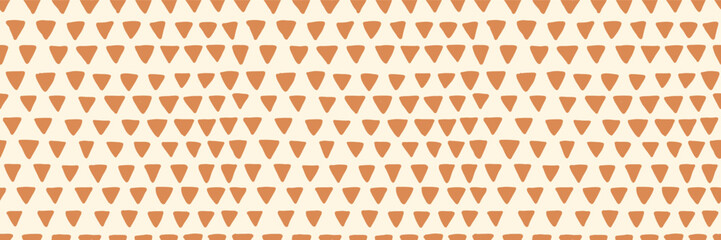 Bohemian baby seamless pattern. Abstract simple doodle triangle geometric background. Neutral trendy colors. Vector illustration. Beige and terracotta colors.