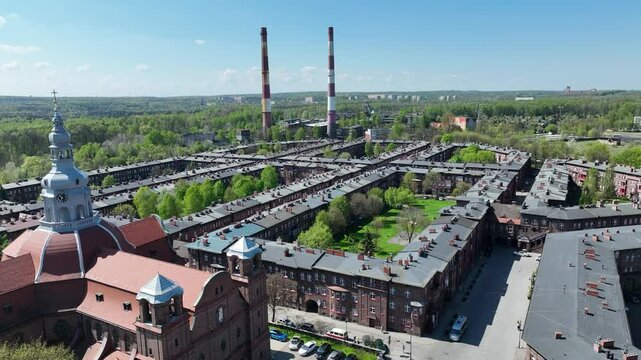  Aerial Drone view of the Historic Nikiszowiec Estate. Breathtaking View of  Iconic Red Brick Architecture and Unique Mining Settlement in Katowice. Historic Nikiszowiec District Aerial Drone Footage.