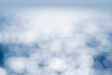 Sea. Abstract view of the blue sea with ripples on the water and white sun glare on a sunny summer day. Nature. Natural background. Blurred background. Concept summer vacation travel tourism