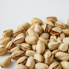 Fresh Pistachios: Nutritious Green Nuts on a White Background
