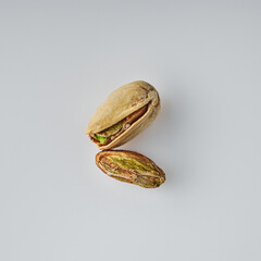 Fresh Pistachios: Nutritious Green Nuts on a White Background