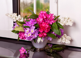 Beautiful Bouquet of Lilacs and Rhododendrons by the Window