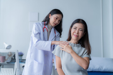 consulting female patient about pills and discussing health treatment sitting in the office at the...