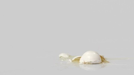 An egg falling and breaking open. Shot with a high-speed camera. - Powered by Adobe