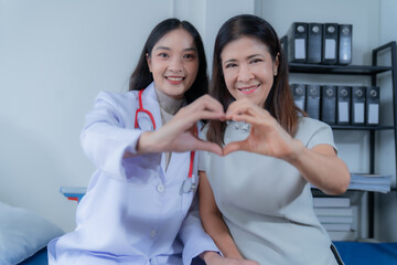 consulting female patient about pills and discussing health treatment sitting in the office at the desk. Medicine and health care concept. Doctor prescribing medicine to patient in the office.