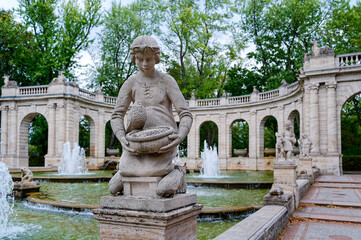 Scene at the historic fairytale fountain with figures from the Grimm Brothers' stories in...