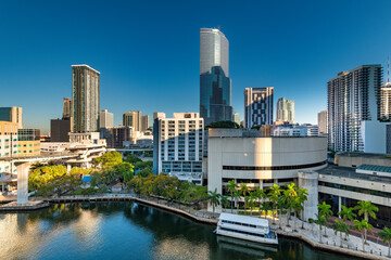 Skyline of office and apartment buildings in downtown Miami, with Miami river at morning, Florida,...