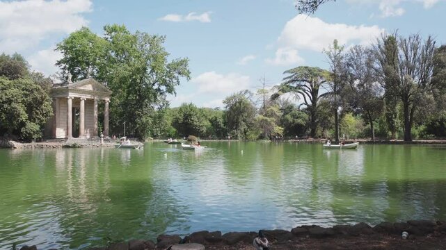 Pond with Temple of Aesculapius in gardens of Villa Borghese, Rome, Italy - 2 may 2024